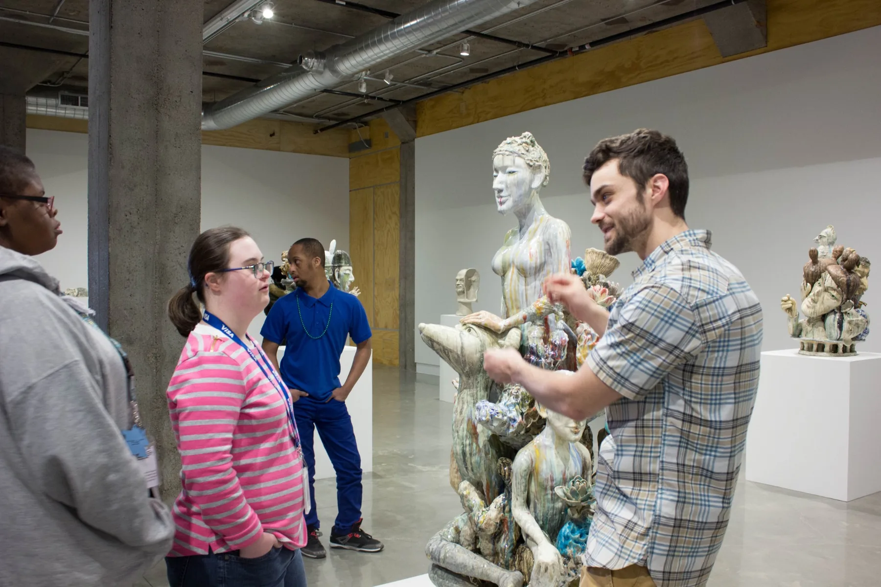 Michael Hollins speaking with arts workshop participants in a KANEKO gallery