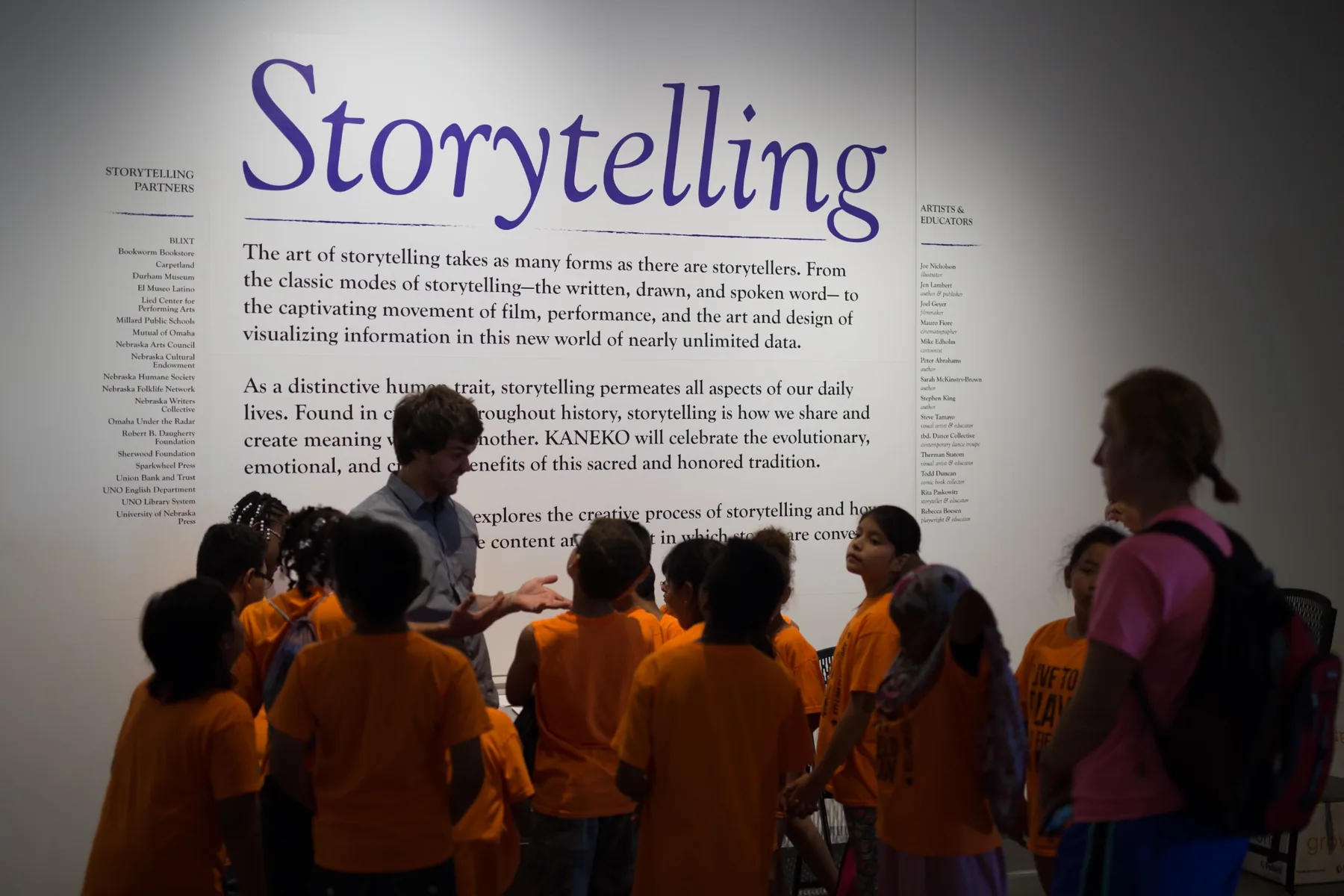 Michael Hollins speaking with students during the Storytelling exhibition at KANEKO in 2016