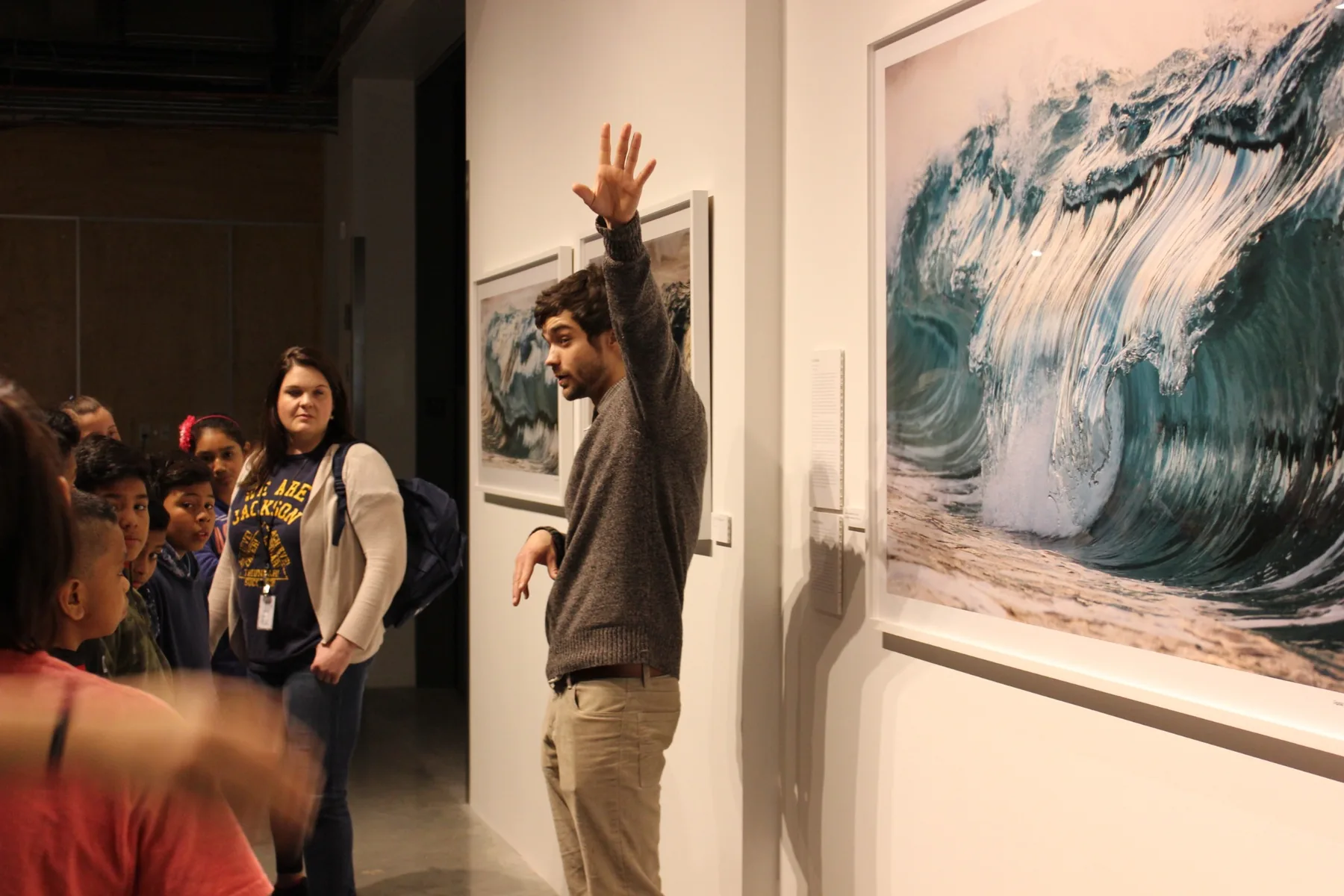 Michael Hollins teaching students beside photography in the WATER exhibition at KANEKO in 2016